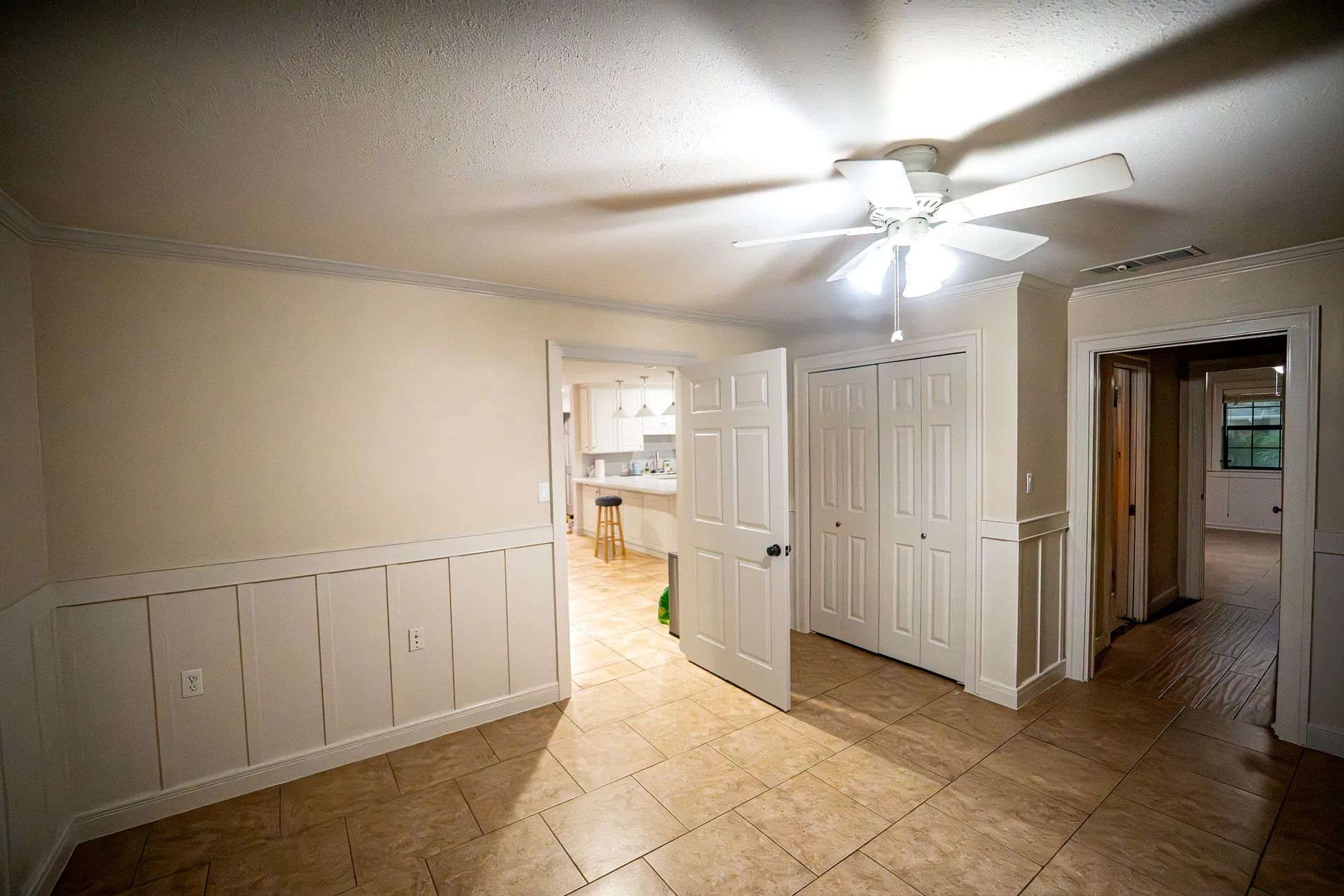 Two-tone interior wall with white wainscoting and crown detail