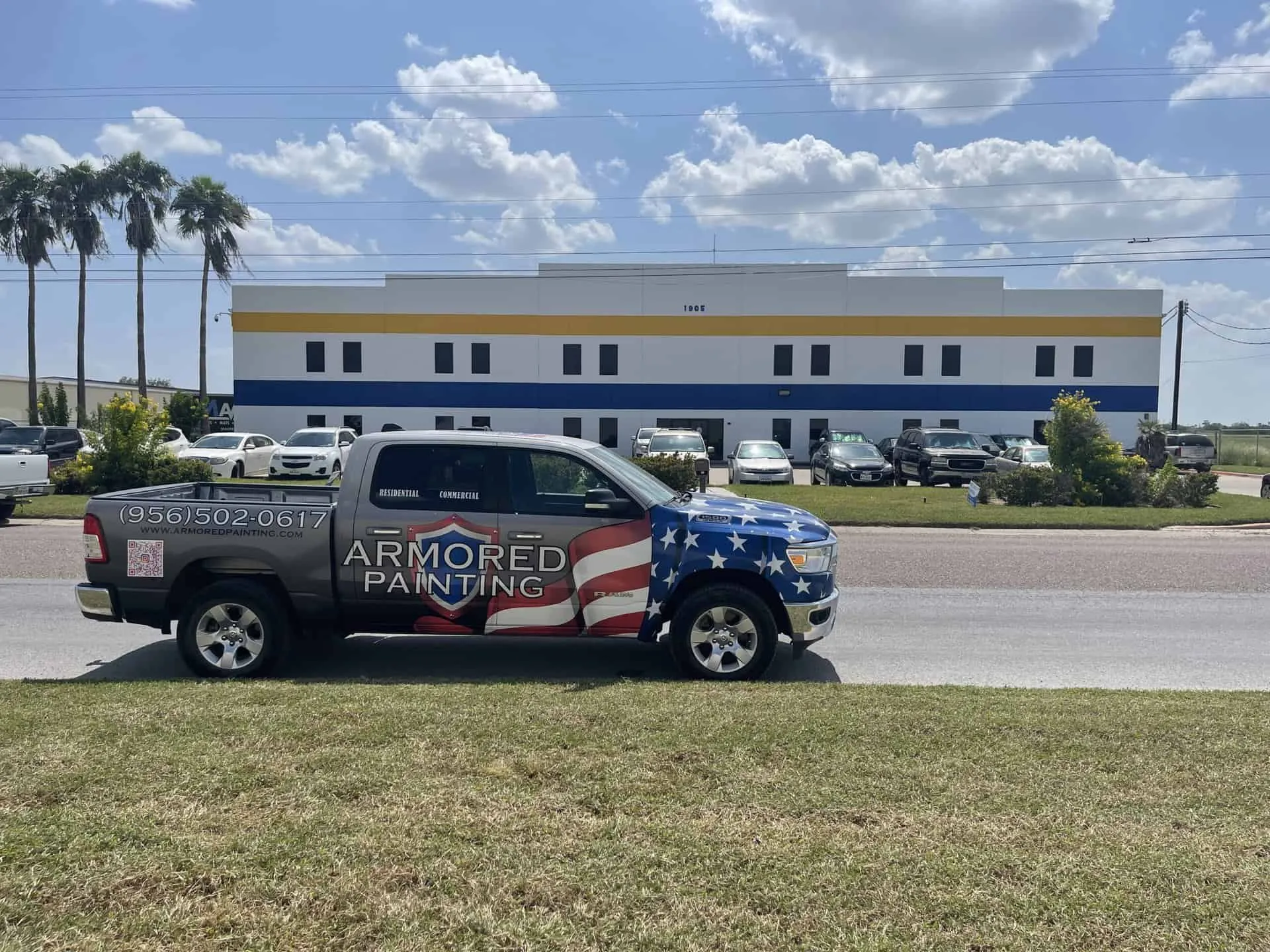 Commercial building painted by Armored Painting with the company truck out front